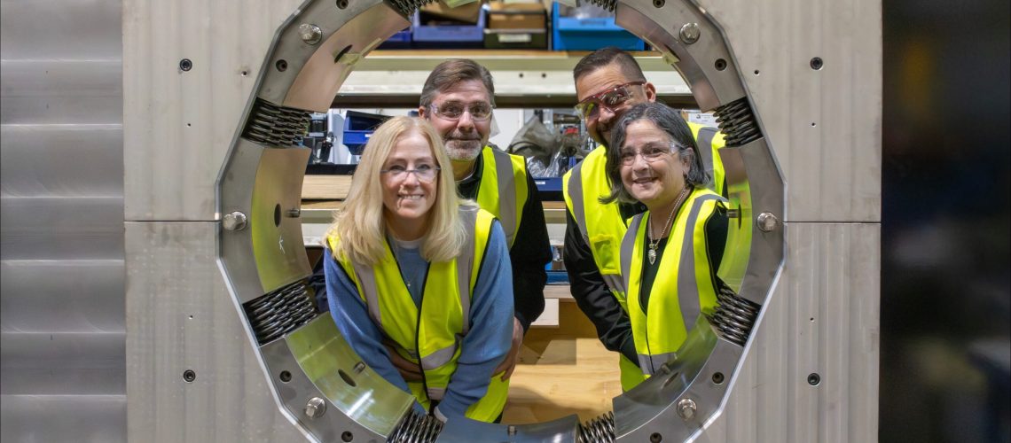 KIH representatives smile through a Finn-Power King Crimper's opening